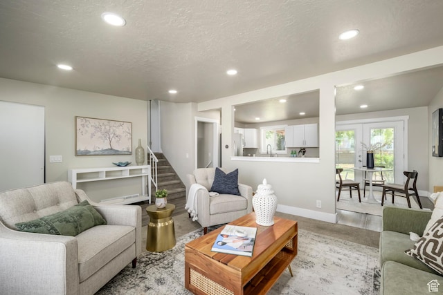 5729 S 150 W, Murray, UT 84107 - living room with recessed lighting, a textured ceiling, and stairway