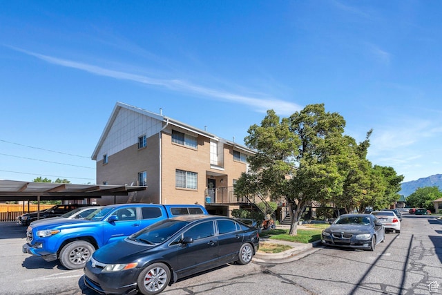 136 E 400 N Unit 207, Provo, UT 84606 - townhome / multi-family property with uncovered parking, stucco siding, and a mountain view
