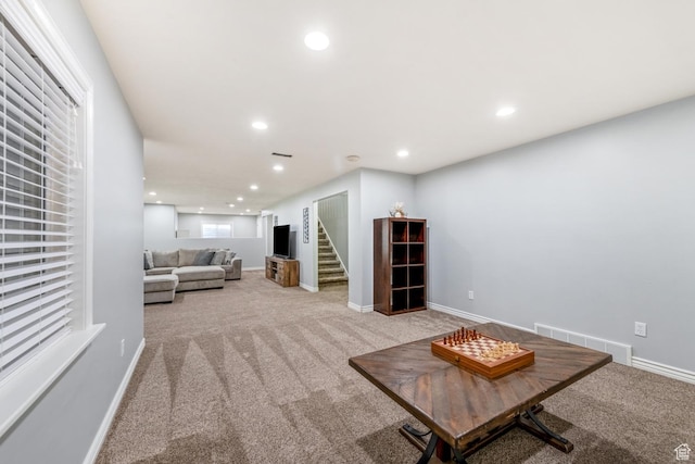 5183 W Heartland Cv, Herriman, UT 84096 - carpeted living room featuring stairs and recessed lighting