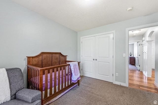5183 W Heartland Cv, Herriman, UT 84096 - carpeted bedroom with a closet and arched walkways