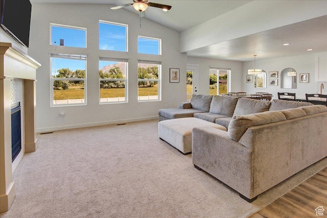 2106 W 2000 N, Farr West, UT 84404 - living room with a ceiling fan, a glass covered fireplace, and high vaulted ceiling