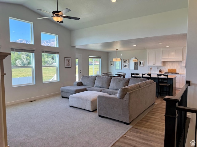 2106 W 2000 N, Farr West, UT 84404 - living area with ceiling fan, light wood finished floors, recessed lighting, and high vaulted ceiling