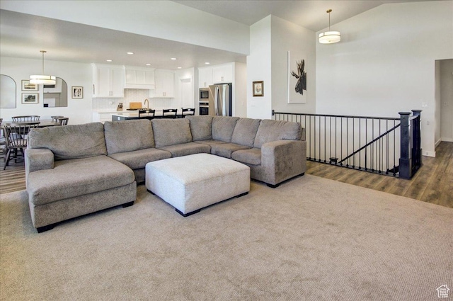 2106 W 2000 N, Farr West, UT 84404 - living room featuring wood finished floors, recessed lighting, and lofted ceiling