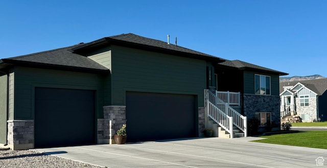 2106 W 2000 N, Farr West, UT 84404 - view of front of house featuring stone siding, a garage, roof with shingles, and concrete driveway