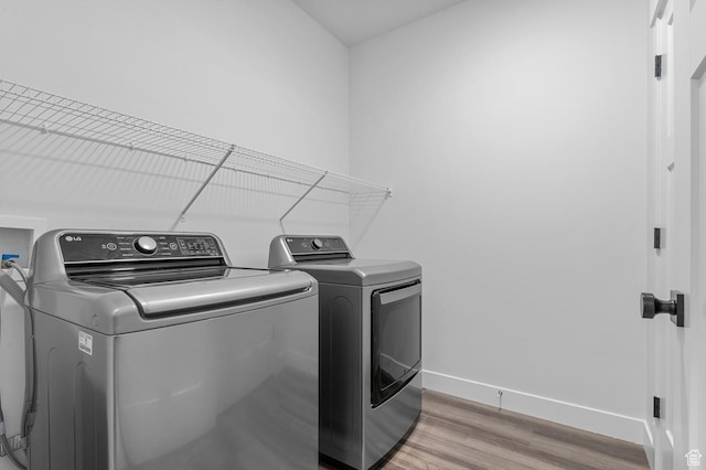 3667 W Canyon Falls Dr Unit S301, Lehi, UT 84043 - laundry room with washing machine and dryer and light wood-style flooring