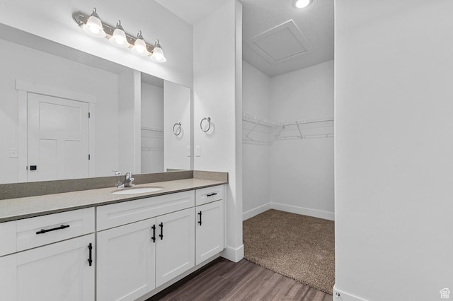3667 W Canyon Falls Dr Unit S301, Lehi, UT 84043 - full bathroom featuring vanity, wood finished floors, a walk in closet, and recessed lighting