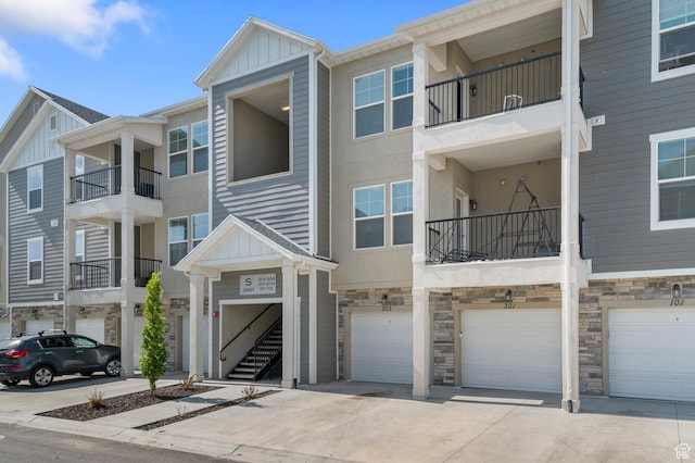 3667 W Canyon Falls Dr Unit S301, Lehi, UT 84043 - view of building exterior with an attached garage and driveway