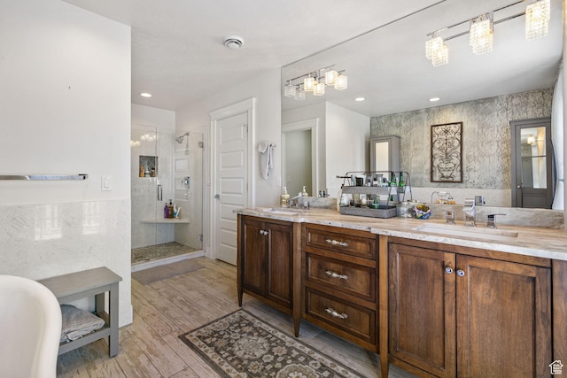 1046 W 1100 N, Pleasant Grove, UT 84062 - bathroom with a shower stall, double vanity, wood finished floors, recessed lighting, and a freestanding bath