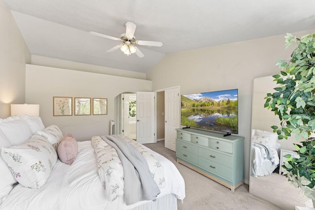 2401 N 1400 E, Layton, UT 84040 - bedroom featuring light carpet, vaulted ceiling, arched walkways, ceiling fan, and ensuite bathroom