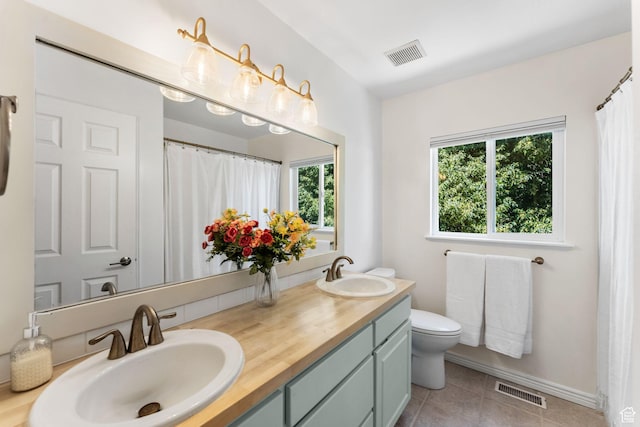 2401 N 1400 E, Layton, UT 84040 - full bath featuring double vanity, tile patterned flooring, and a shower with curtain