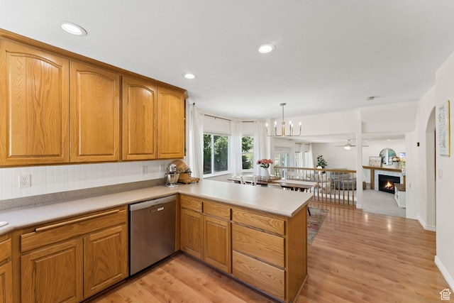 2401 N 1400 E, Layton, UT 84040 - kitchen featuring stainless steel dishwasher, a peninsula, light wood-style floors, open floor plan, and recessed lighting