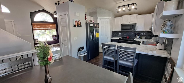 5256 S 3400 W, Roy, UT 84067 - kitchen featuring black appliances, backsplash, vaulted ceiling, white cabinets, and dark wood-style flooring