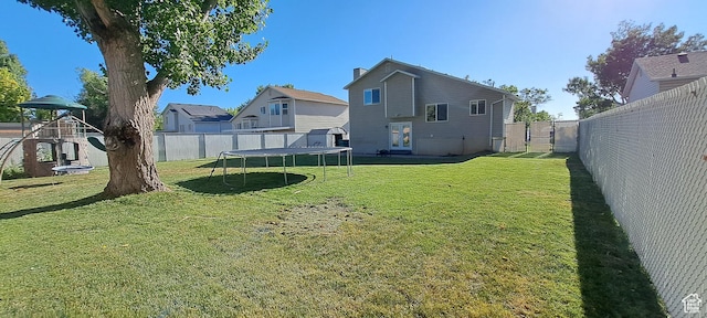 5256 S 3400 W, Roy, UT 84067 - fenced backyard featuring a trampoline and a playground