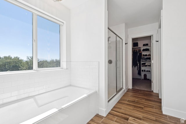 67 N 300 E, Vineyard, UT 84059 - full bath with a stall shower, a garden tub, a walk in closet, and wood finished floors