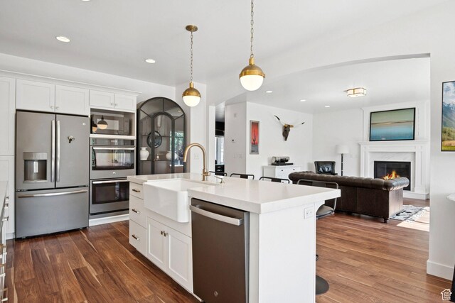 67 N 300 E, Vineyard, UT 84059 - kitchen with appliances with stainless steel finishes, dark wood-style floors, light countertops, white cabinetry, and recessed lighting