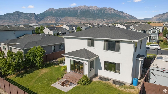 67 N 300 E, Vineyard, UT 84059 - back of property with a residential view, roof with shingles, a mountain view, and stucco siding