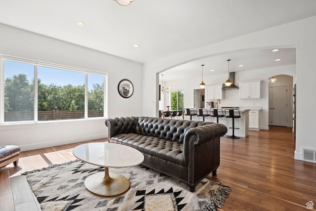 67 N 300 E, Vineyard, UT 84059 - living area featuring arched walkways, hardwood / wood-style floors, and recessed lighting