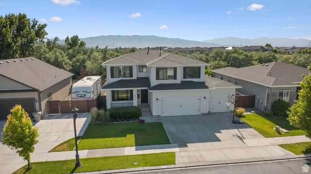 67 N 300 E, Vineyard, UT 84059 - traditional-style home featuring concrete driveway, roof with shingles, a gate, and a mountain view