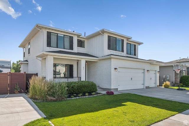 67 N 300 E, Vineyard, UT 84059 - view of front of property featuring an attached garage, a porch, concrete driveway, board and batten siding, and brick siding