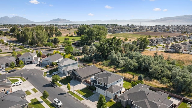 67 N 300 E, Vineyard, UT 84059 - aerial view of property and surrounding area with nearby suburban area and a water and mountain view