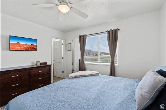2144 E Easter Dr, Eagle Mountain, UT 84005 - bedroom with ceiling fan and a textured ceiling