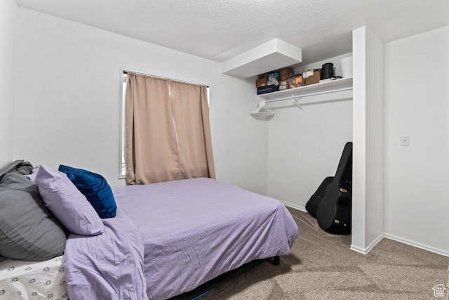 2144 E Easter Dr, Eagle Mountain, UT 84005 - carpeted bedroom featuring a textured ceiling and a closet