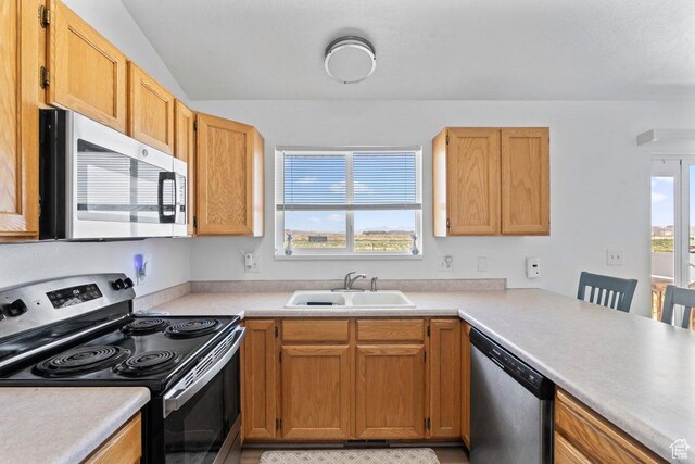 2144 E Easter Dr, Eagle Mountain, UT 84005 - kitchen featuring stainless steel appliances, light countertops, and vaulted ceiling