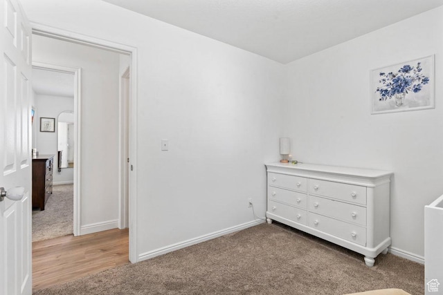 2144 E Easter Dr, Eagle Mountain, UT 84005 - bedroom with light carpet and light wood-style flooring