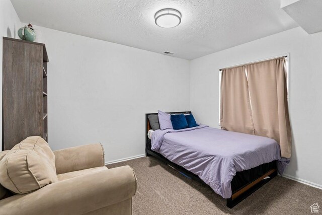 2144 E Easter Dr, Eagle Mountain, UT 84005 - bedroom featuring carpet floors and a textured ceiling