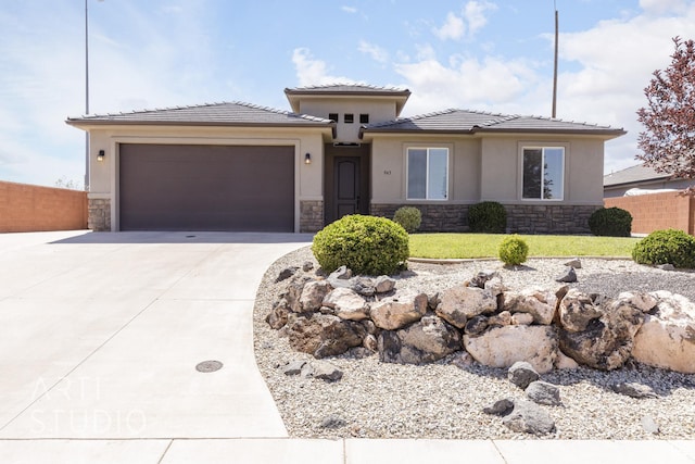 943 N 100 W, Hurricane, UT 84737 - prairie-style home featuring stone siding, driveway, a garage, and stucco siding