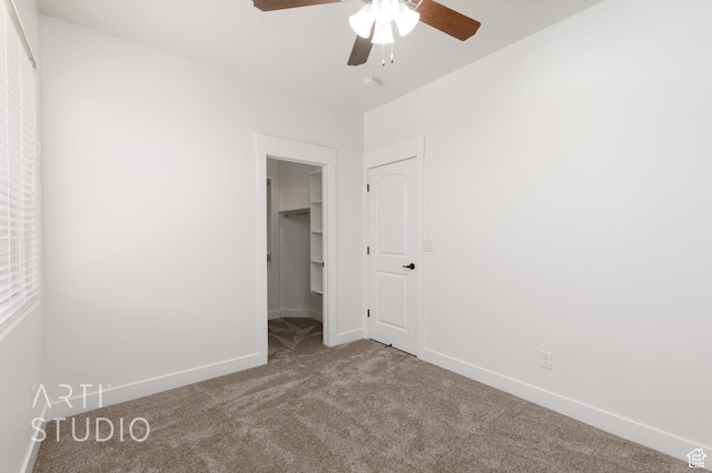 943 N 100 W, Hurricane, UT 84737 - unfurnished bedroom featuring carpet floors, a spacious closet, ceiling fan, and a closet
