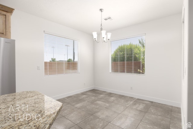 943 N 100 W, Hurricane, UT 84737 - unfurnished dining area with a chandelier and light tile patterned flooring