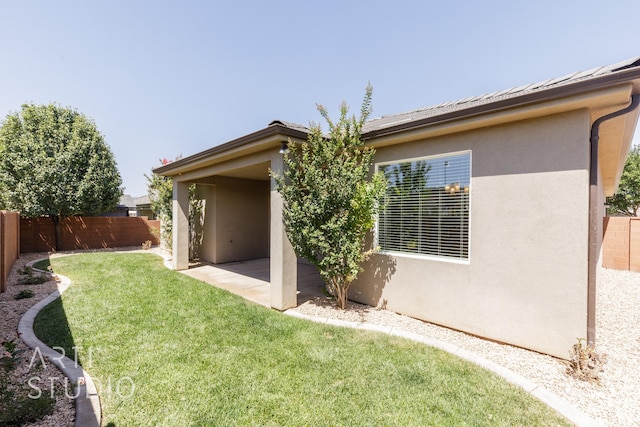 943 N 100 W, Hurricane, UT 84737 - rear view of house with a fenced backyard, stucco siding, and a patio area