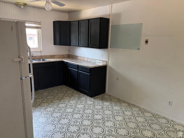332 W Amiron Way Unit D, Orem, UT 84057 - kitchen featuring freestanding refrigerator, light countertops, ceiling fan, and dark cabinetry