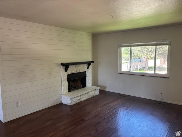 332 W Amiron Way Unit D, Orem, UT 84057 - unfurnished living room with wood finished floors, a stone fireplace, and a textured ceiling