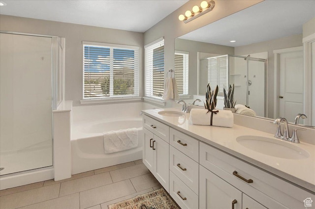 12232 S Sigmon Ln, Herriman, UT 84096 - bathroom with a stall shower, double vanity, a garden tub, and tile patterned floors