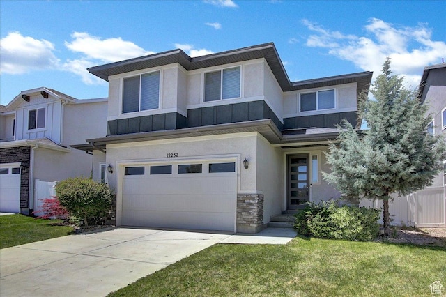 12232 S Sigmon Ln, Herriman, UT 84096 - view of front of home with stone siding, stucco siding, a garage, driveway, and a standing seam roof