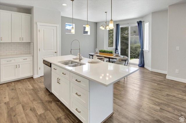 12232 S Sigmon Ln, Herriman, UT 84096 - kitchen with dishwasher, light countertops, an island with sink, backsplash, and recessed lighting