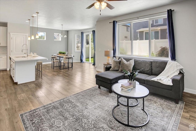 12232 S Sigmon Ln, Herriman, UT 84096 - living room featuring a ceiling fan and wood finished floors