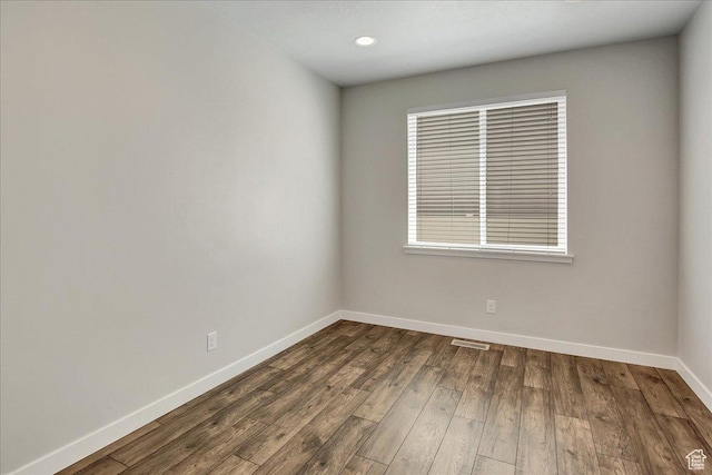 12232 S Sigmon Ln, Herriman, UT 84096 - unfurnished room featuring dark wood-type flooring and recessed lighting