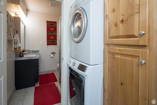 3686 S Spanish Valley Dr Unit Y1, Moab, UT 84532 - washroom featuring stacked washer and clothes dryer and light tile patterned floors
