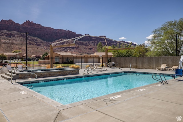 3686 S Spanish Valley Dr Unit Y1, Moab, UT 84532 - community pool featuring a mountain view and a patio