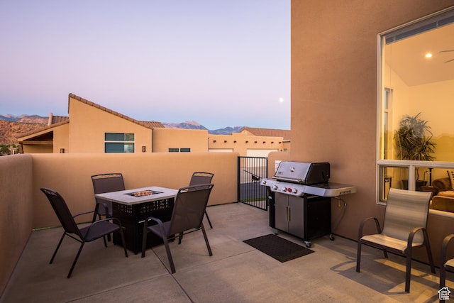 3686 S Spanish Valley Dr Unit Y1, Moab, UT 84532 - view of patio with area for grilling, an outdoor fire pit, and a mountain view