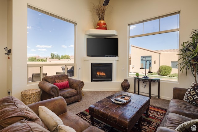 3686 S Spanish Valley Dr Unit Y1, Moab, UT 84532 - living area with carpet, plenty of natural light, and a glass covered fireplace