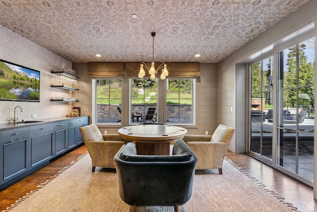 2475 W White Pine Ln Unit 11, Park City, UT 84060 - dining room with a chandelier, wood finished floors, wet bar, and recessed lighting