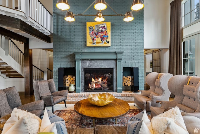 2475 W White Pine Ln Unit 11, Park City, UT 84060 - living room featuring stairs, a high ceiling, a fireplace, and wood finished floors