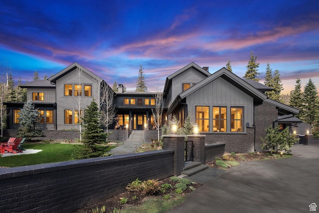 2475 W White Pine Ln Unit 11, Park City, UT 84060 - view of front of house featuring board and batten siding, a chimney, and a front yard