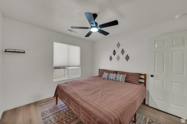 504 E Telegraph St Unit 89, Washington, UT 84780 - bedroom with wood finished floors and a ceiling fan