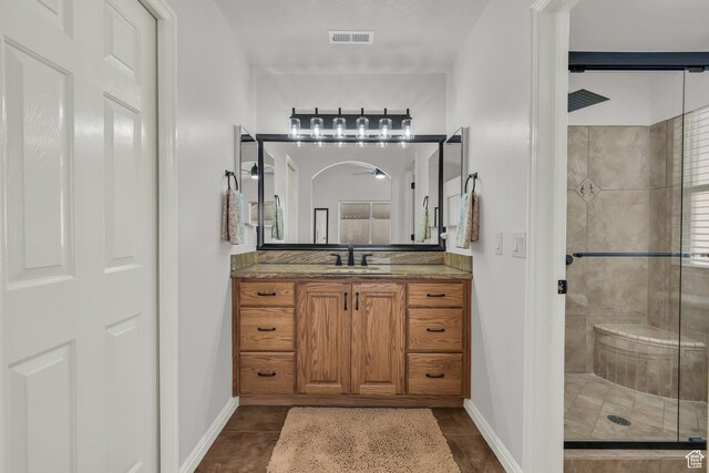 504 E Telegraph St Unit 89, Washington, UT 84780 - bathroom featuring a stall shower, vanity, and tile patterned flooring