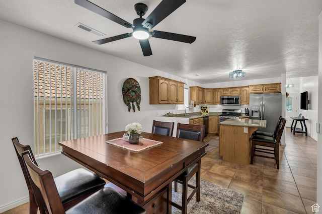 504 E Telegraph St Unit 89, Washington, UT 84780 - dining area featuring ceiling fan and a textured ceiling